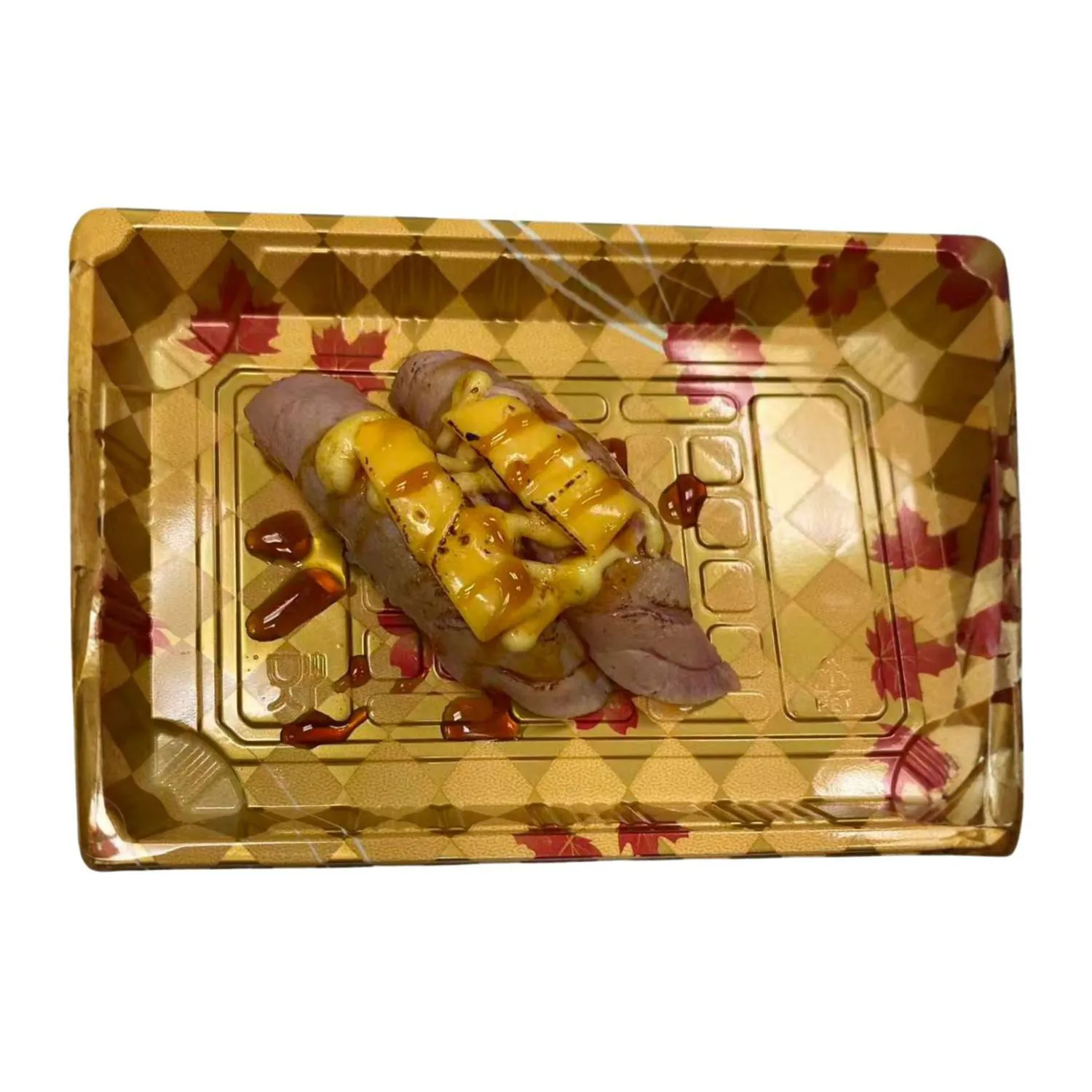 Sushi rolls topped with melted cheese and sauce at LR Sushi, a Japanese Restaurant in London